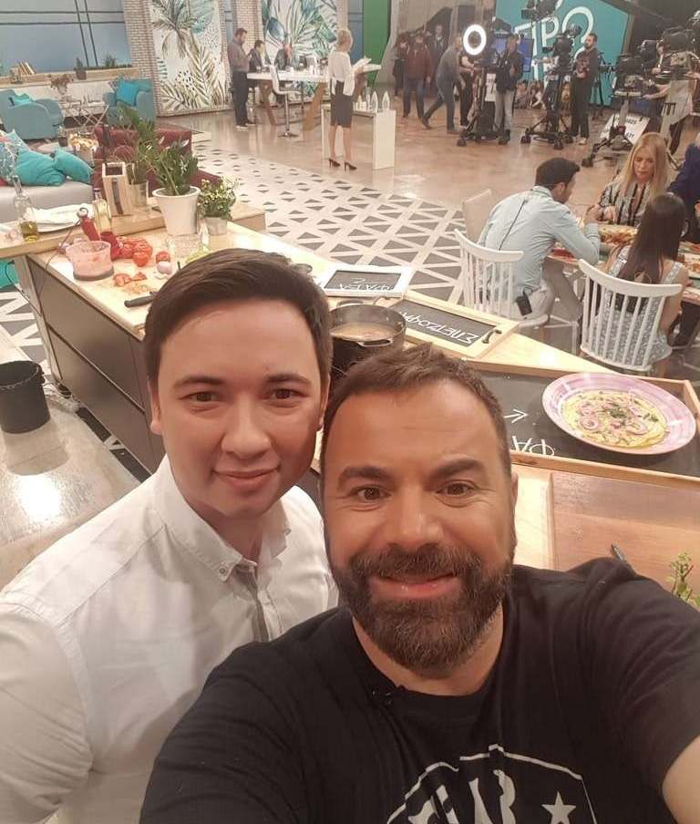 Eugene Charalampous with a presenter on the set of a morning show