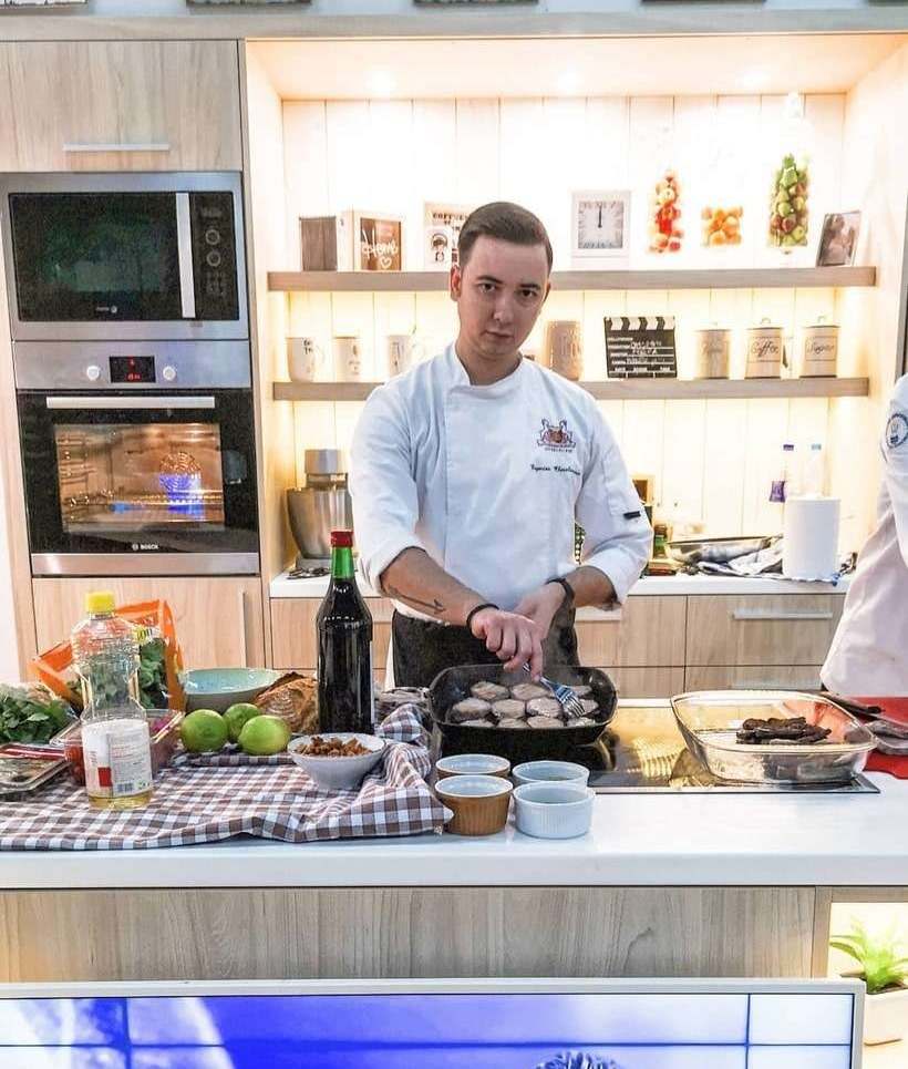 Eugene Charalampous cooking on a television studio kitchen set